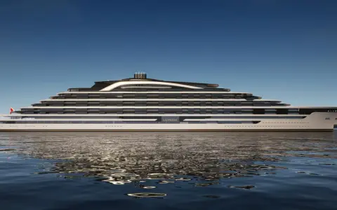 Eine futuristische mega Yacht namens ULYSSIA gleitet auf ruhigem Wasser.