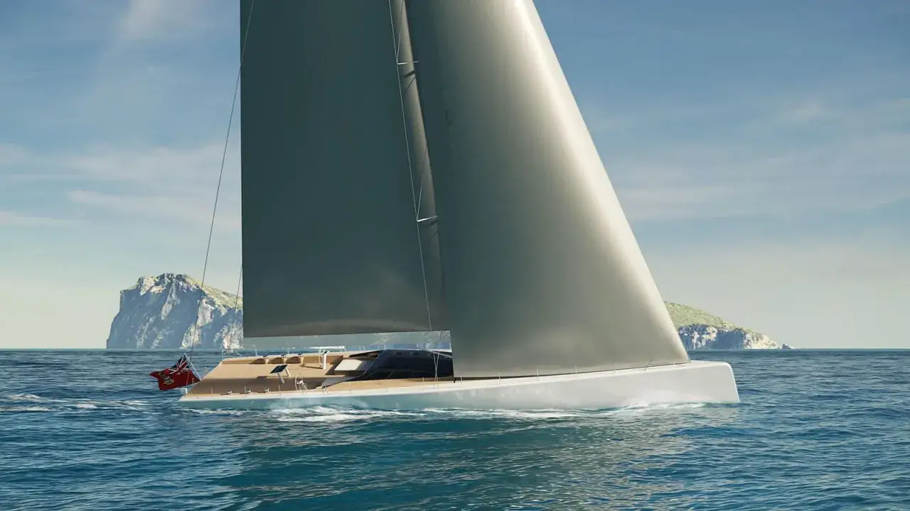 Die Segelyacht Andromeda gleitet majestätisch über das blaue Meer, vorbei an felsigen Inseln unter einem klaren Himmel.